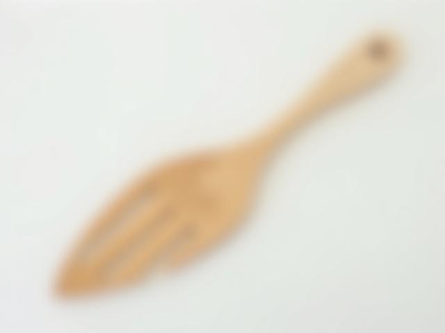 The Slotted Fish Spatula, a cherry wood spatula with delicate slots.